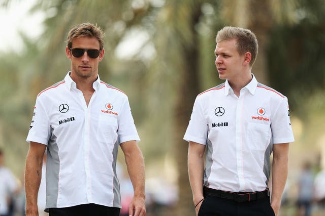 Jenson Button will be partnered by rookie Kevin Magnussen at McLaren next season
