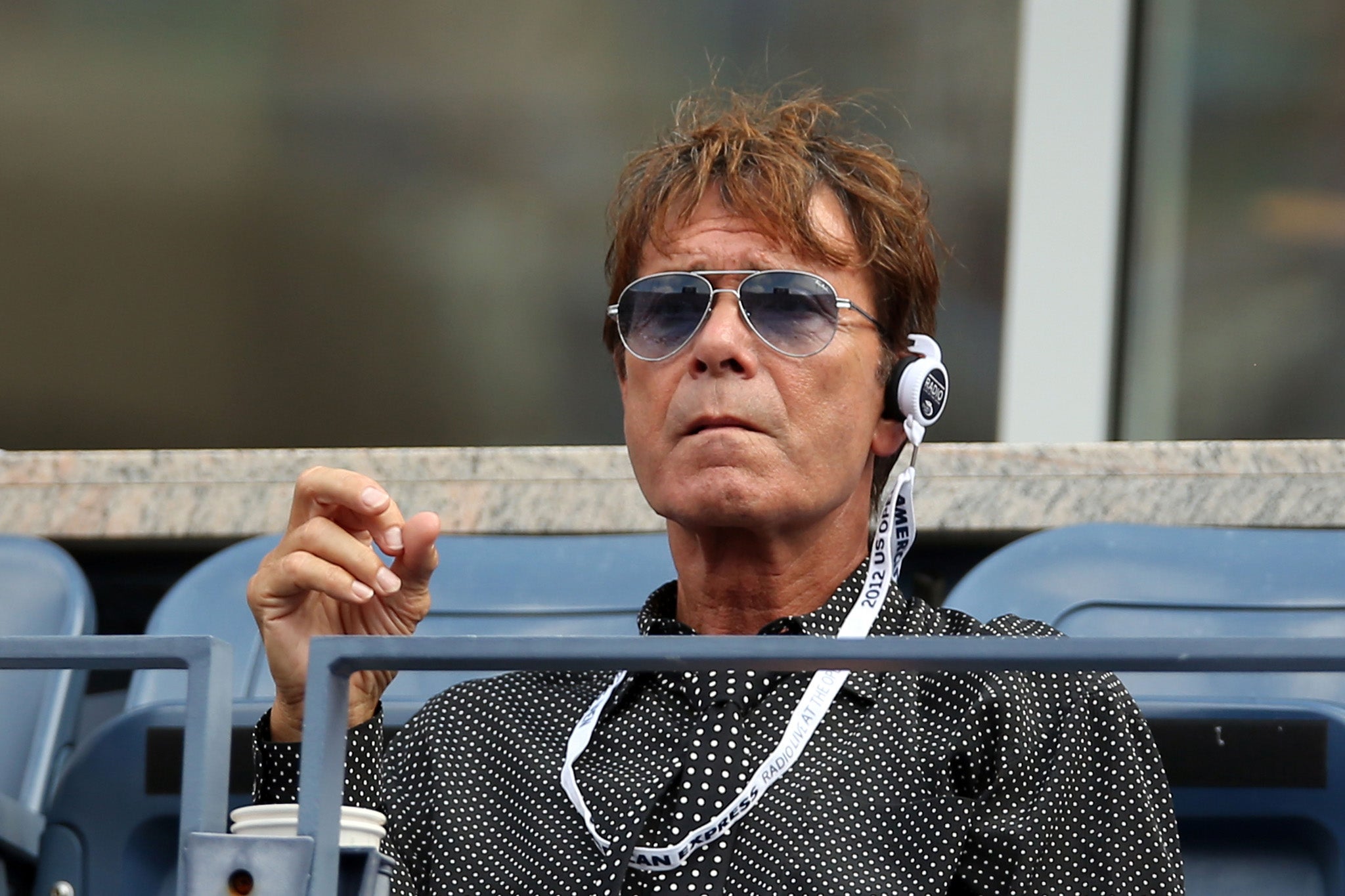 Sir Cliff Richard at the 2012 US Open. The crooner claimed One Direction still compete with him to 'look cool'