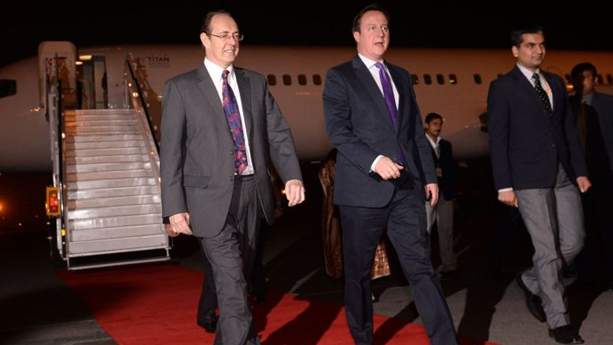 Prime Minister David Cameron arrives in Delhi today greeted by British High Commissioner James Bevan (left) for the start of  a two day visit to India