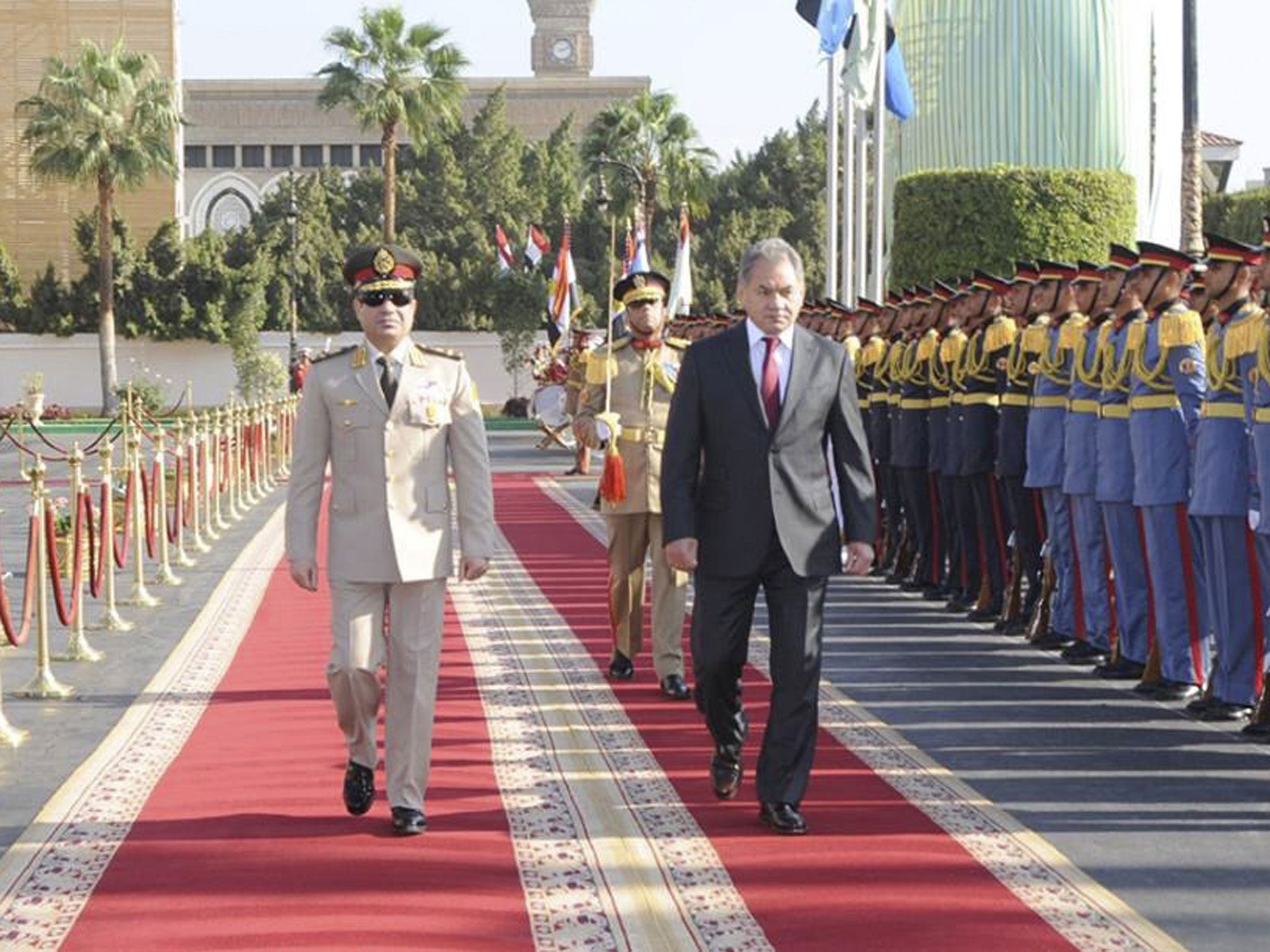 Egypt's Army Chief and Defence Minister General Abdel Fattah al-Sisi, right, walks with Russia's Defence Minister Sergei Shoigu
