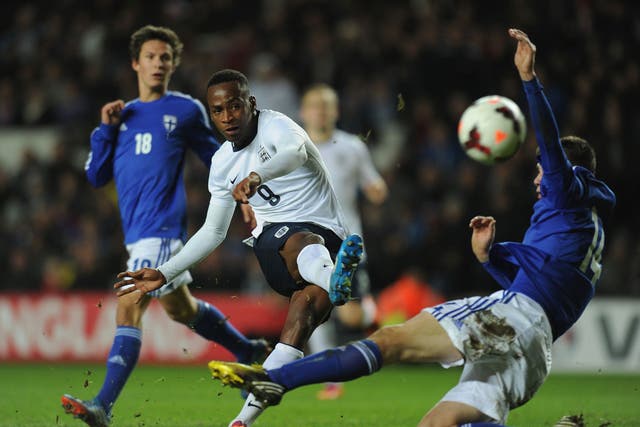 England Under-21 striker Saido Berahino fires past Daniel O'Shaunessy of Finland Under-21s