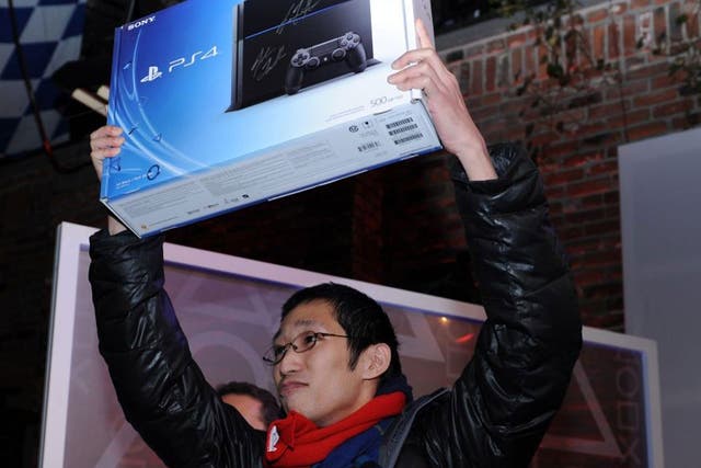 Joey Chiu, 24-year-old from Brooklyn, New York is first on line to receive the new Sony PlayStation FOUR at the Standard High Line in New York