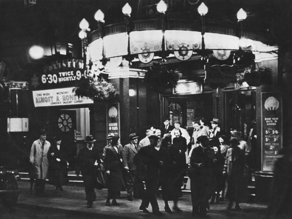 The audience leaves the Coliseum Theatre, London, after seeing 'Almost A Honeymoon', circa 1935.