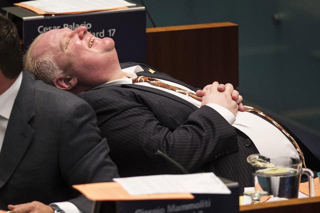 Rob Ford laughs during council at City Hall in Toronto