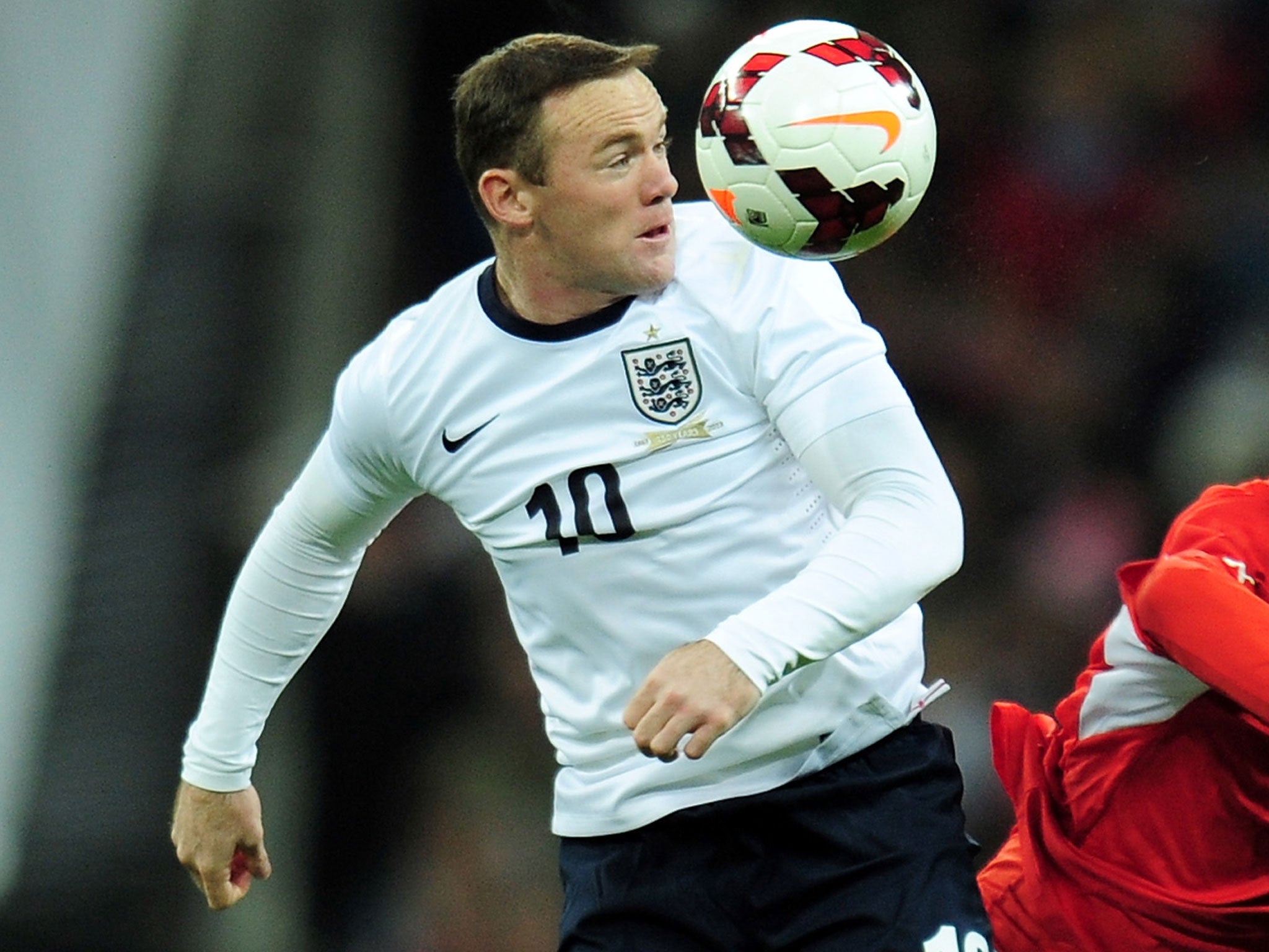 Wayne Rooney wins the ball against Chile on Friday night