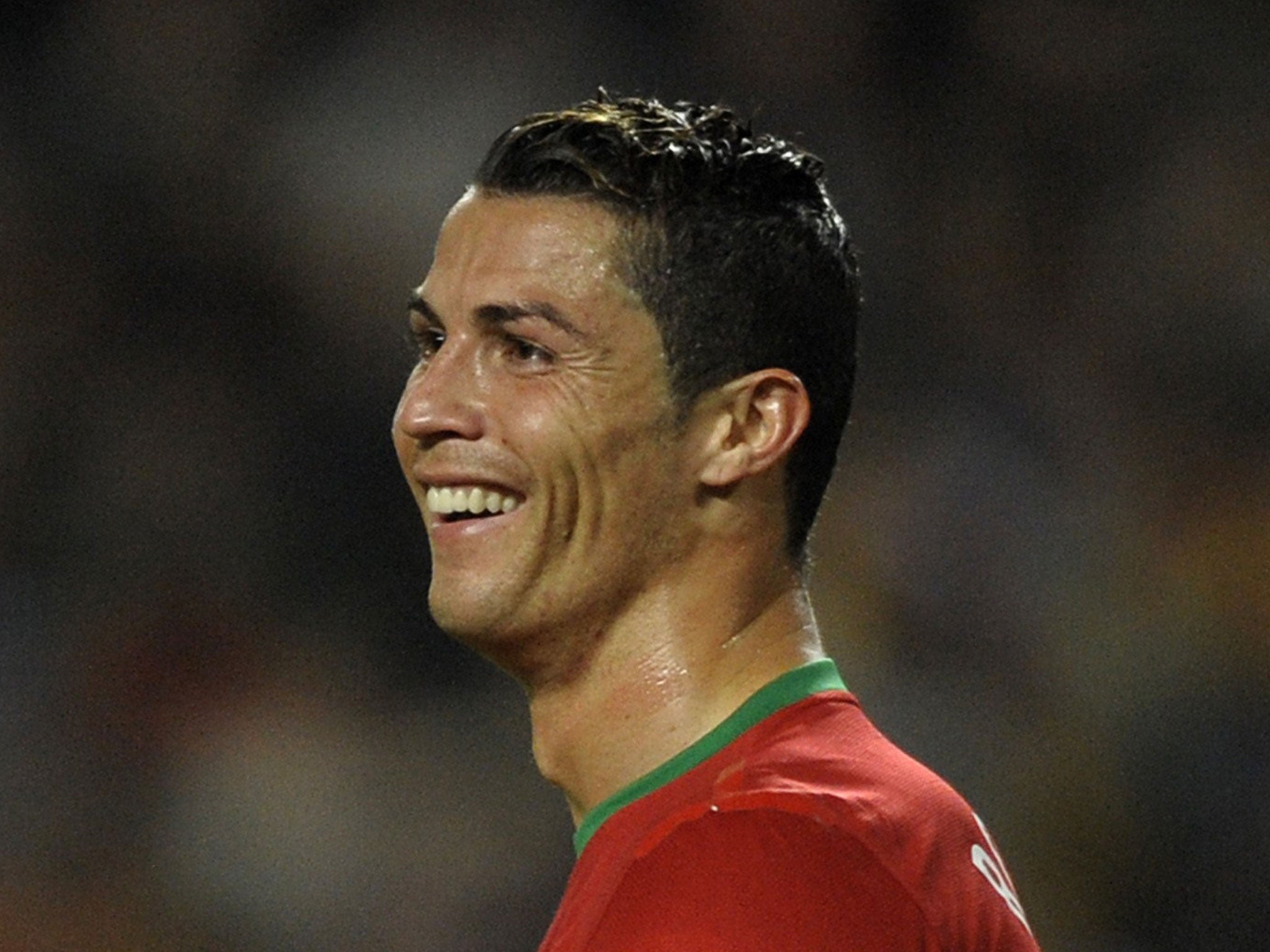 Cristiano Ronaldo smiles during the match Portugal against Sweden at the Luz stadium in Lisbon
