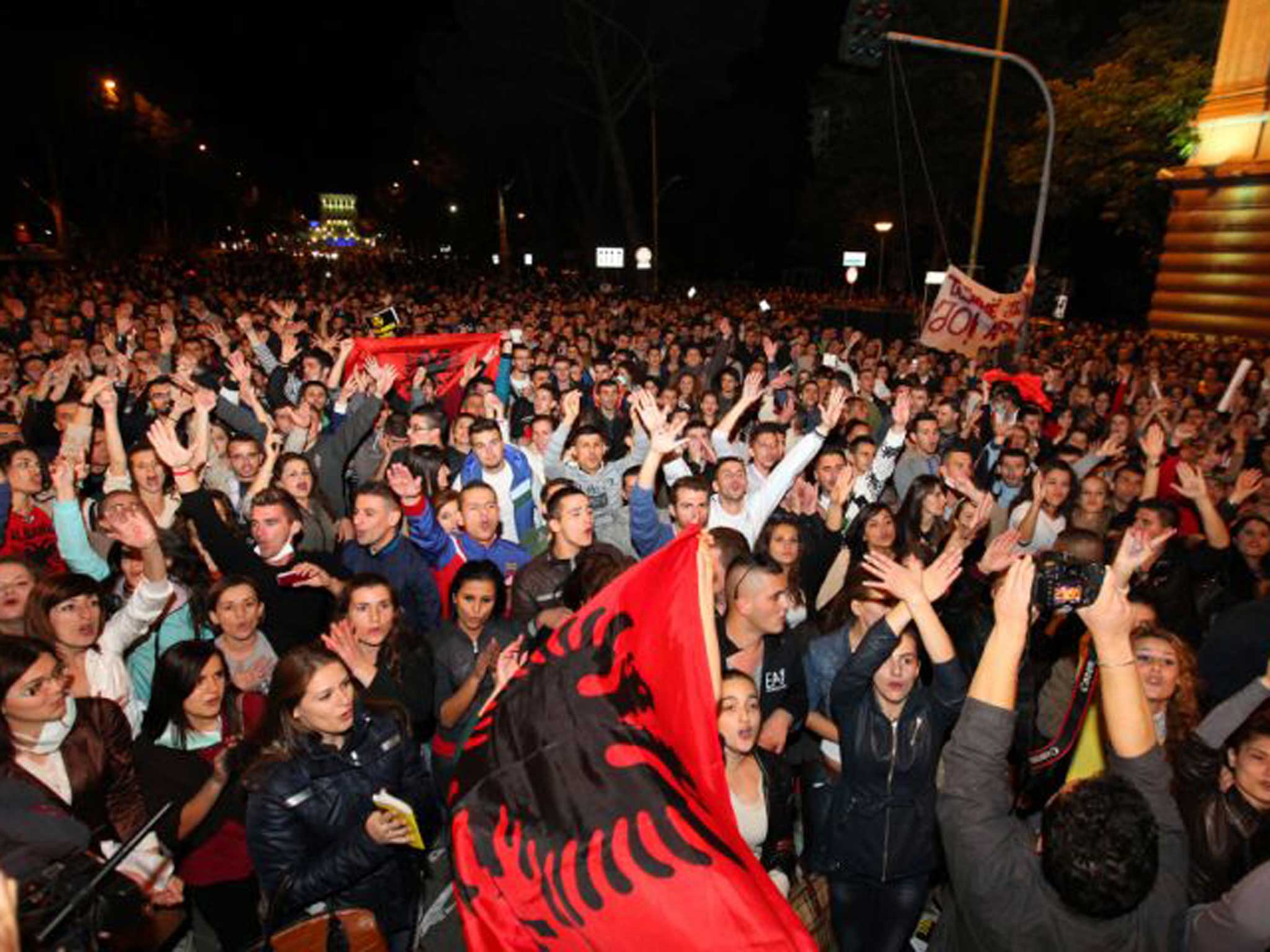 Thousands of Albanians celebrate Prime Minister Edi Rama's announcement that Albania will not host destruction of Syria's chemical weapons stockpile