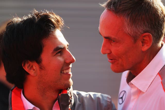 McLaren team principal Martin Whitmarsh (R) has admitted he is doing his utmost to find Sergio Perez (L) a 2014 drive