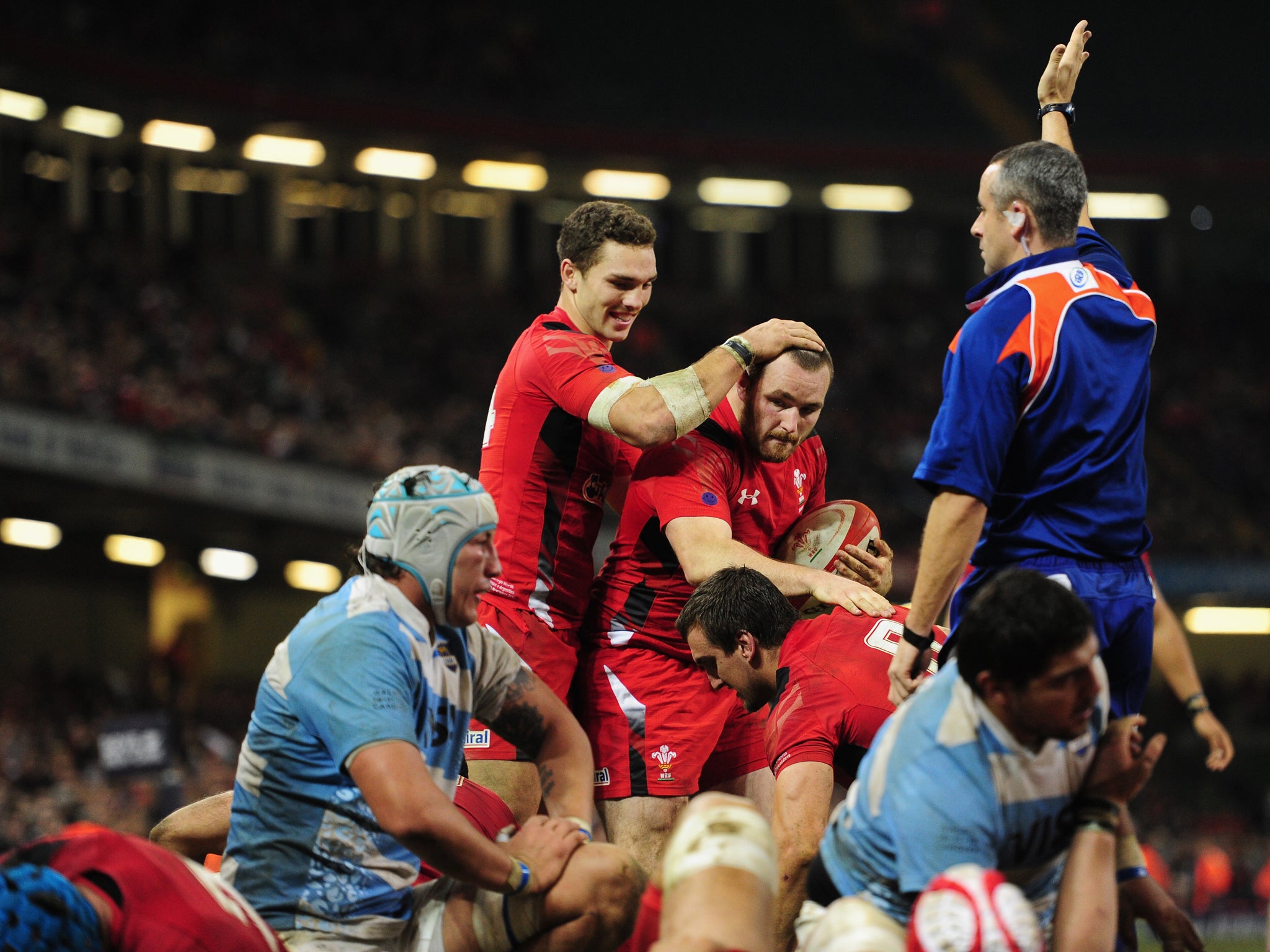 Ken Owens celebrates with George North after scoring Wales' fourth try
