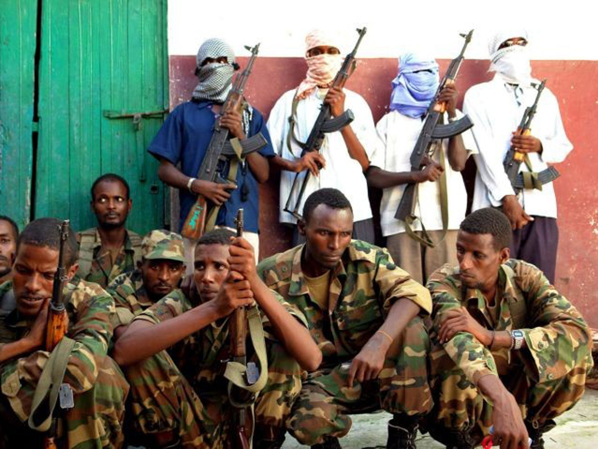 Masked captors: Islamist insurgents with soldiers rounded up in Somalia, 2008