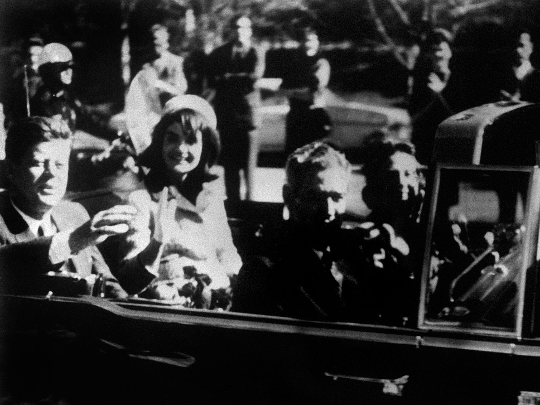 President John F Kennedy and his first lady Jackie, moments before the fatal shot was fired