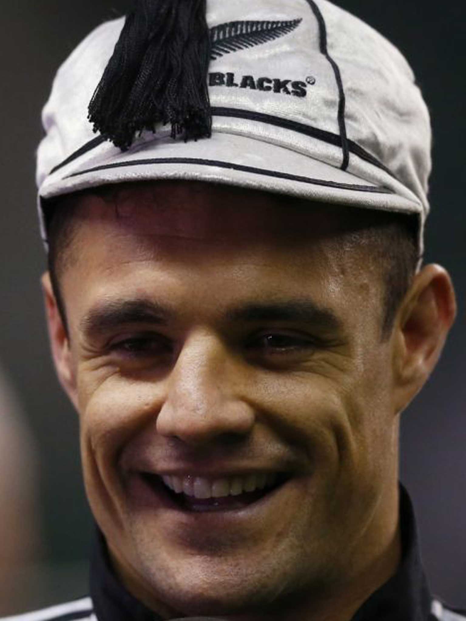Shining example: Dan Carter sports the cap he received for making his 100th Test appearance