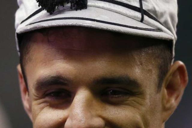 Shining example: Dan Carter sports the cap he received for making his 100th Test appearance