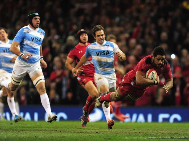 Dragon flies: Toby Faletau dives over to score Wales’ second try in yesterday’s win over Argentina