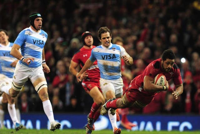 Dragon flies: Toby Faletau dives over to score Wales’ second try in yesterday’s win over Argentina