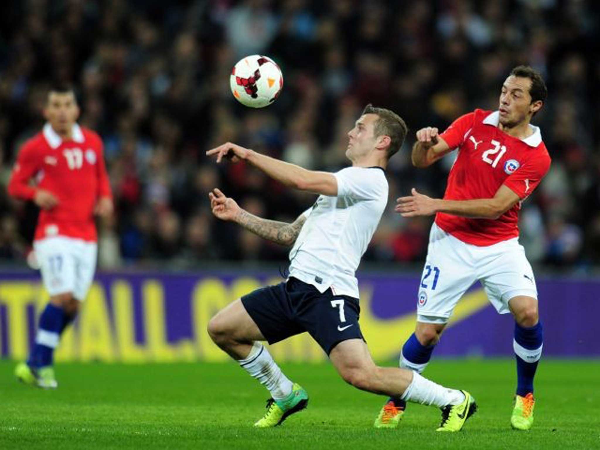 Jack Wilshere shields the ball from Chile’s Marcelo Diaz at Wembley on Friday