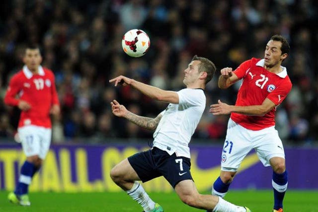The eyes have it: Jack Wilshere, England’s key midfielder, shields the ball from Chile’s Marcelo Diaz at Wembley on Friday