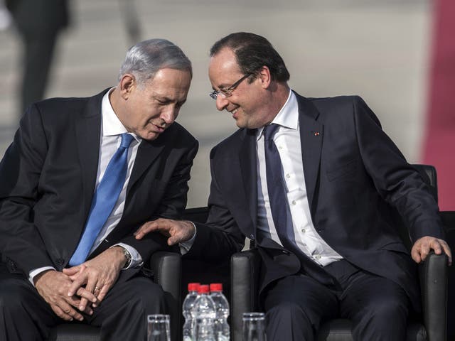 Israel’s Prime Minister Benjamin Netanyahu, left, with the French President Francois Hollande, right, said France was a ‘true friend’ in Tel Aviv