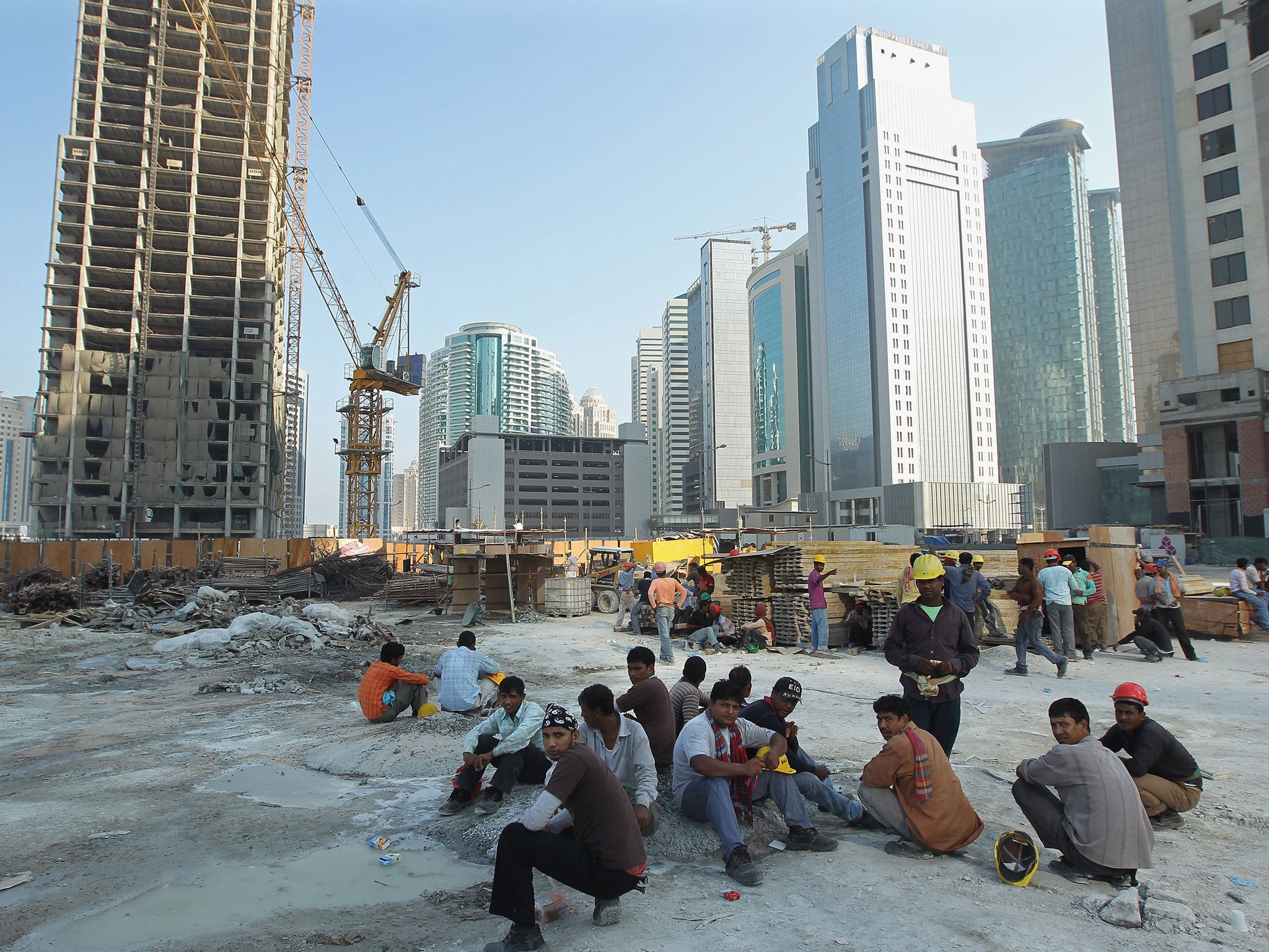 Tens of thousands of workers on the 2022 football World Cup in Qatar cannot get home to see their families