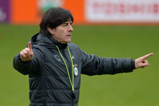 Joachim Low points the way for Germany during training in Barnet as they prepare to face England at Wembley on Tuesday night