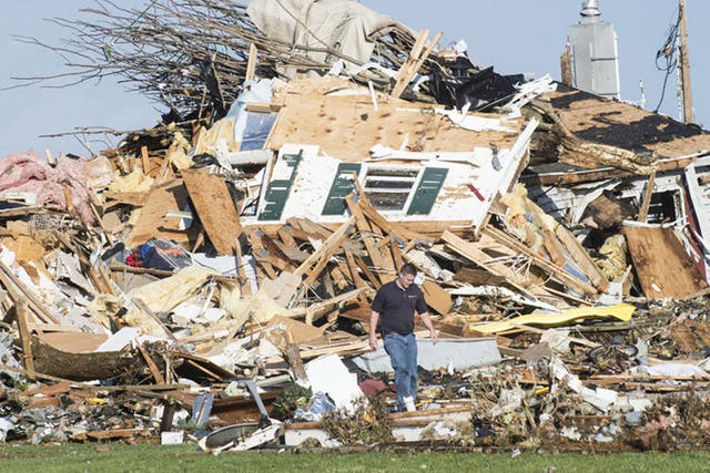 A series of tornadoes sweeping across Illinois and Indiana have killed at least two people and injured at least 40 while flattening large parts of the city of Washington in Illinois