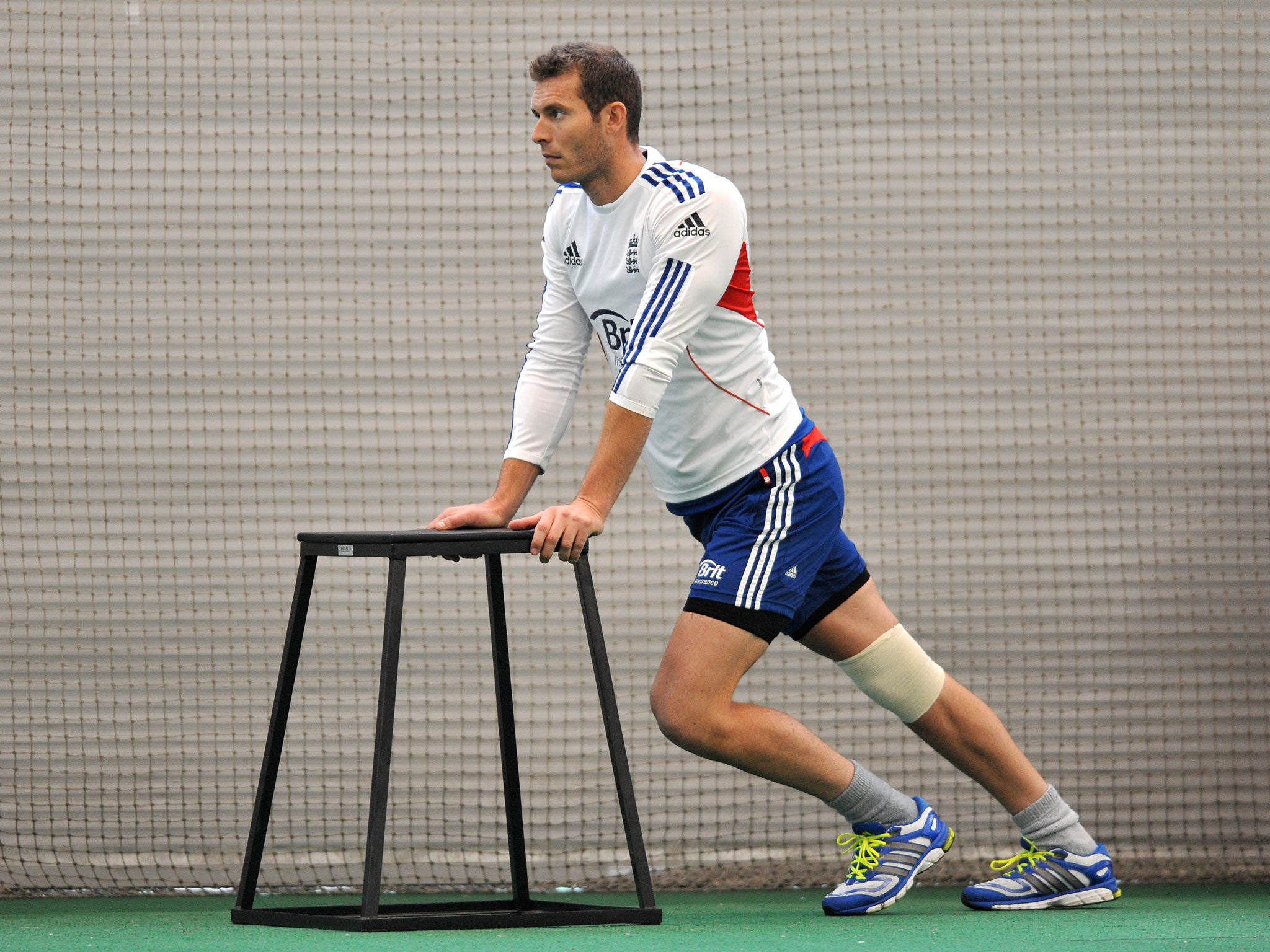 Chris Tremlett stretches ahead of an England training session in the build-up to this week’s first Ashes test