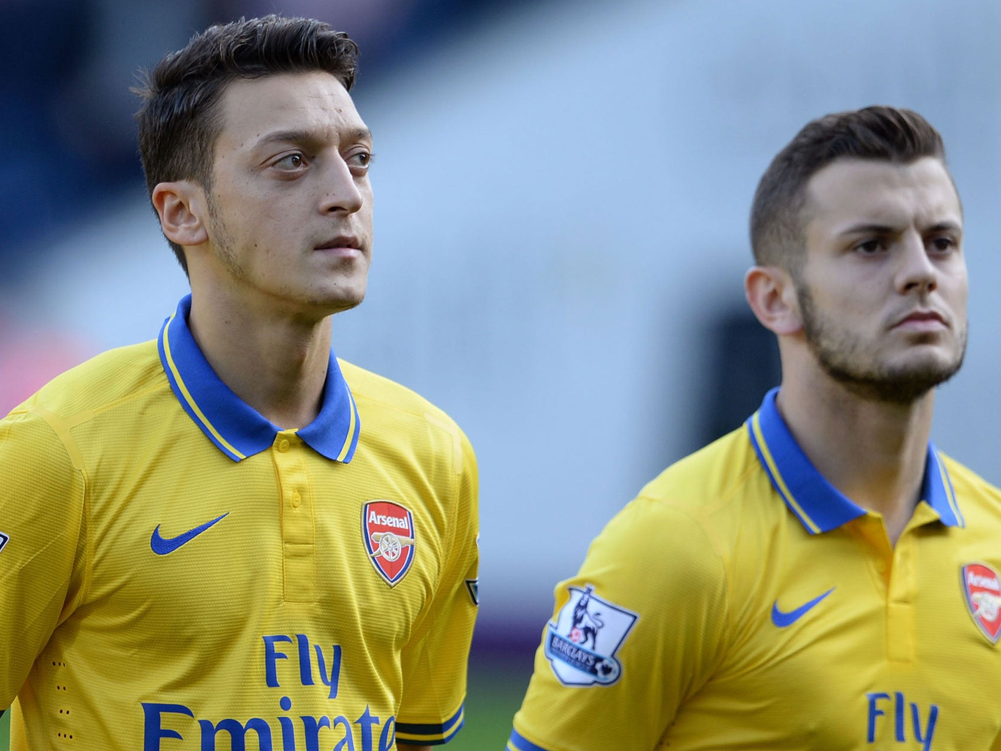 Mesut Ozil (left) and Jack Wilshere line up for Arsenal