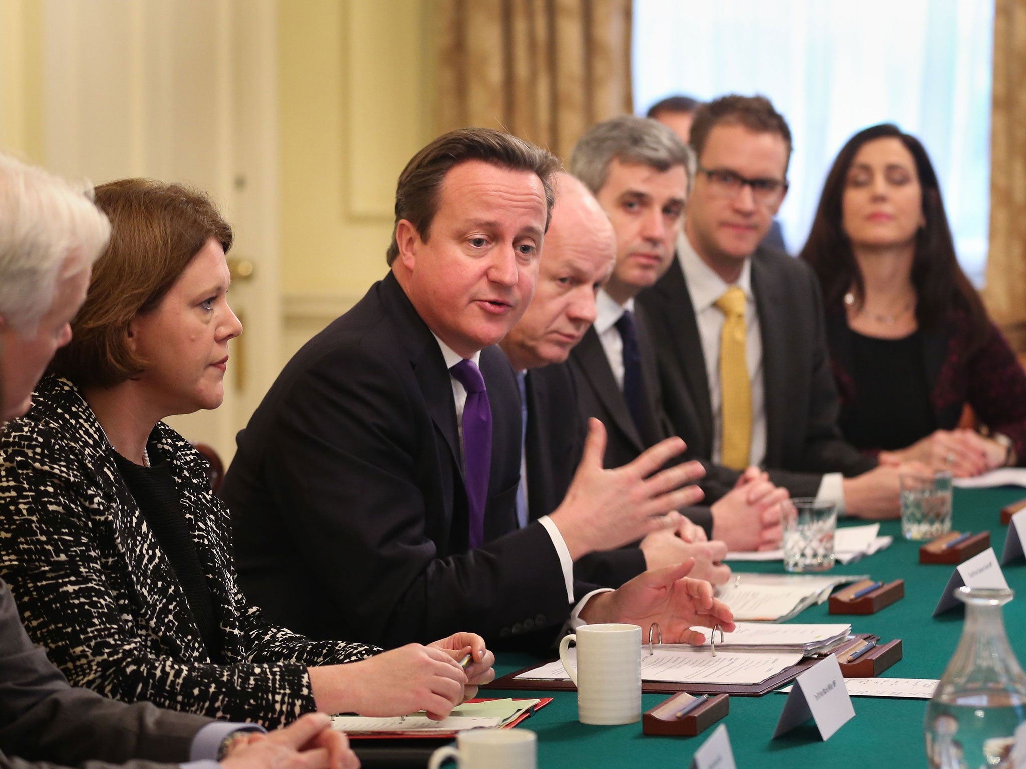 Secretary of State for Culture Media and Sport Maria Miller (second left) and Prime Minister David Cameron (centre) talk to members of leading search engines, internet service providers, the National Crime Agency and the NSPCC, during a child abuse summit