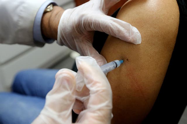 Eligible adults may be given flu vaccine vouchers to use at their local pharmacies