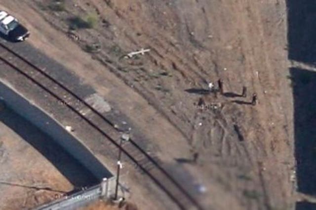 A blurred screenshot from Google Maps showing the scene captured by Google's satellite imagery.