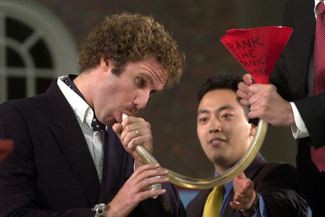 Actor Will Ferrell shows Harvard students how to use a beer funnel