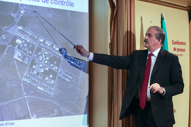 Mehdi Abrichamtchi (C), Peace and Security Committee Chairman of the National Council of Resistance of Iran (NCRI) shows to journalists a secret nuclear site in Iran during a press conference on November 18, 2013 in Paris.