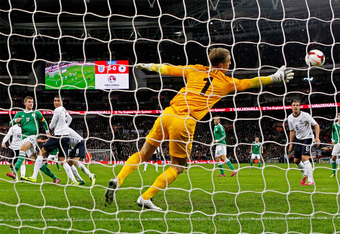 Per Mertesacker watches as his header beats Joe Hart to give Germany the lead (Getty)