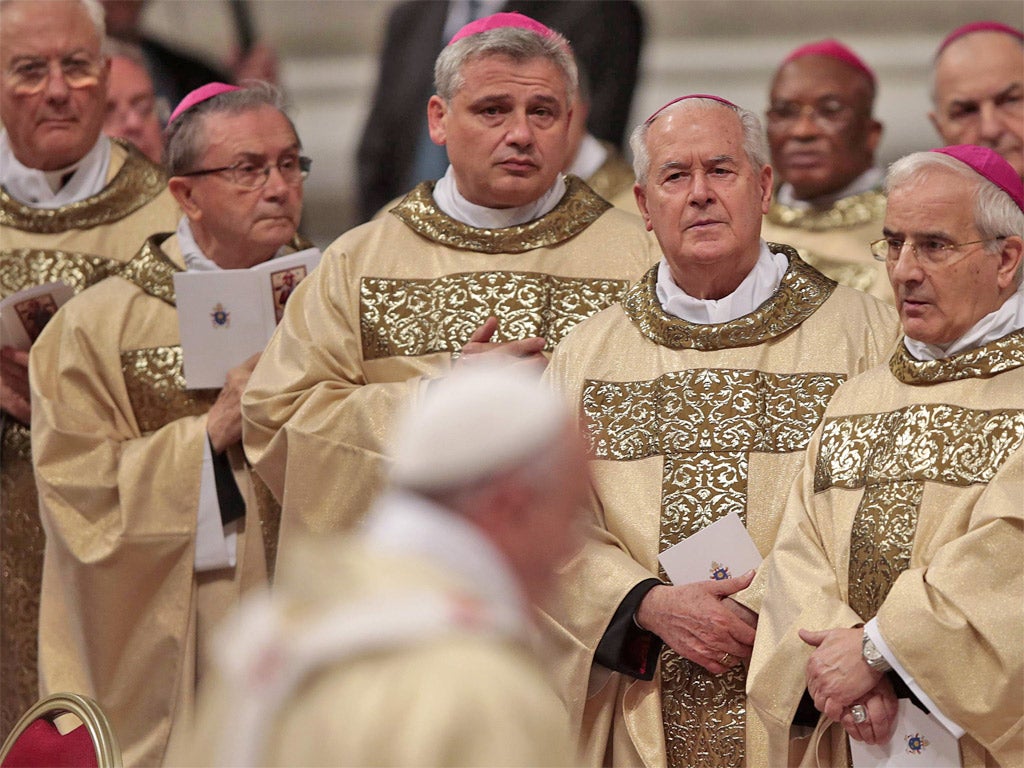 Bishops look on as Pope Francis arrives to lead a bishop ordination ceremony earlier this month