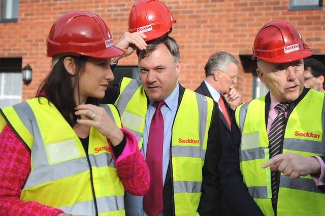 The shadow Chancellor Ed Balls, centre, will promise to underwrite the building of several new towns