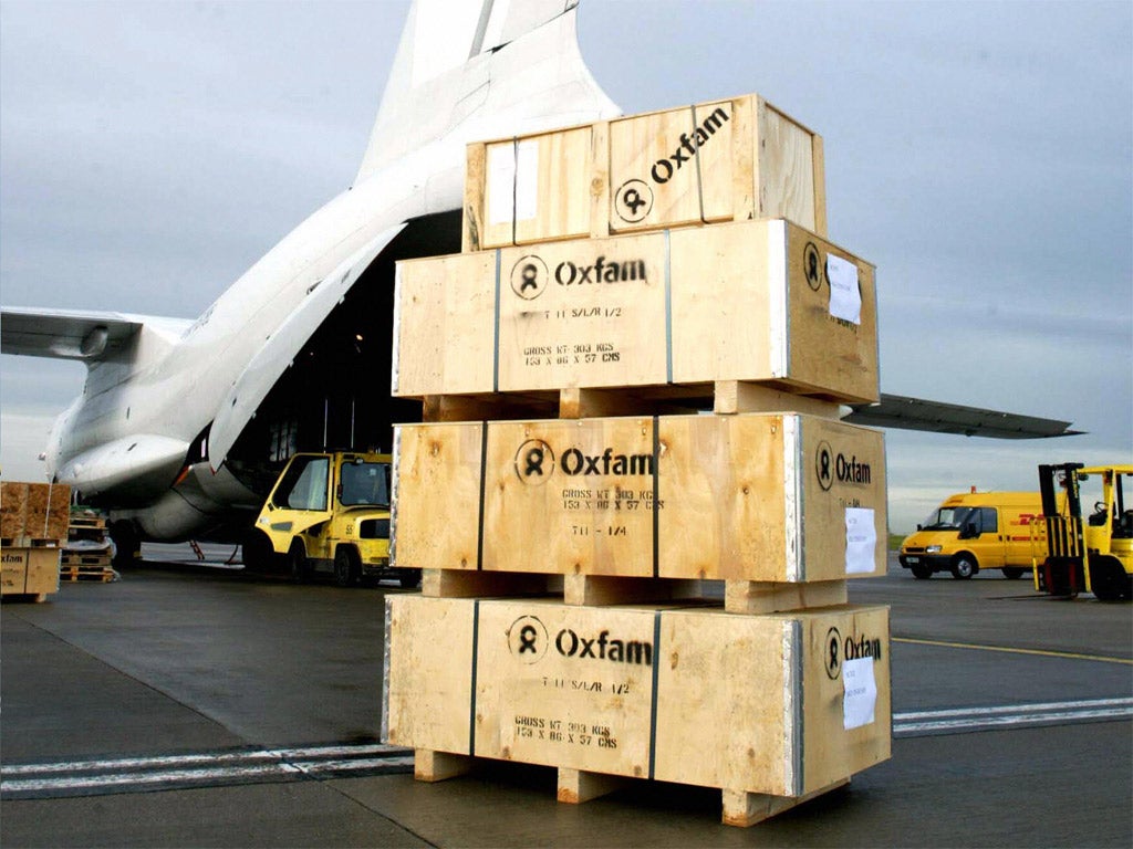 Aid packages from the charity Oxfam wait to be loaded on to a cargo plane