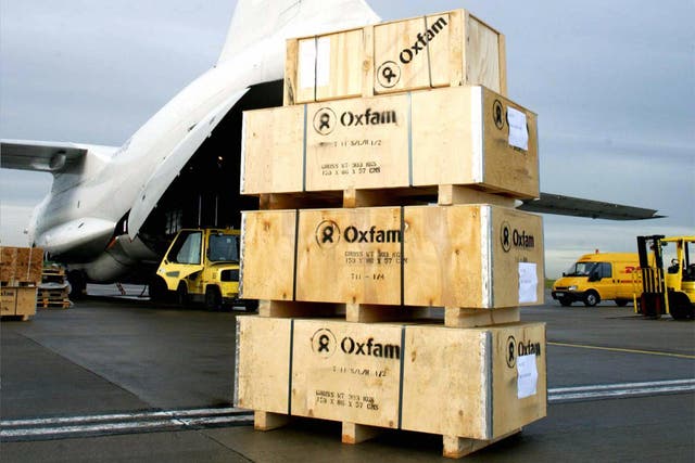 Aid packages from the charity Oxfam wait to be loaded on to a cargo plane