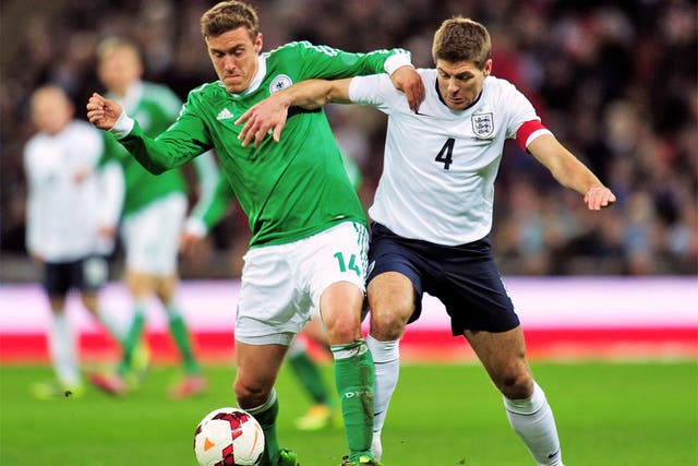 Steven Gerrard tangles with Germany’s Max Kruse