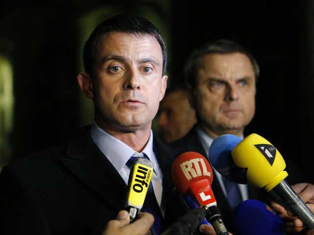 French Interior Minister Manuel Valls (left) and Christian Flaesch, director of the Paris judiciary police, speak to the press