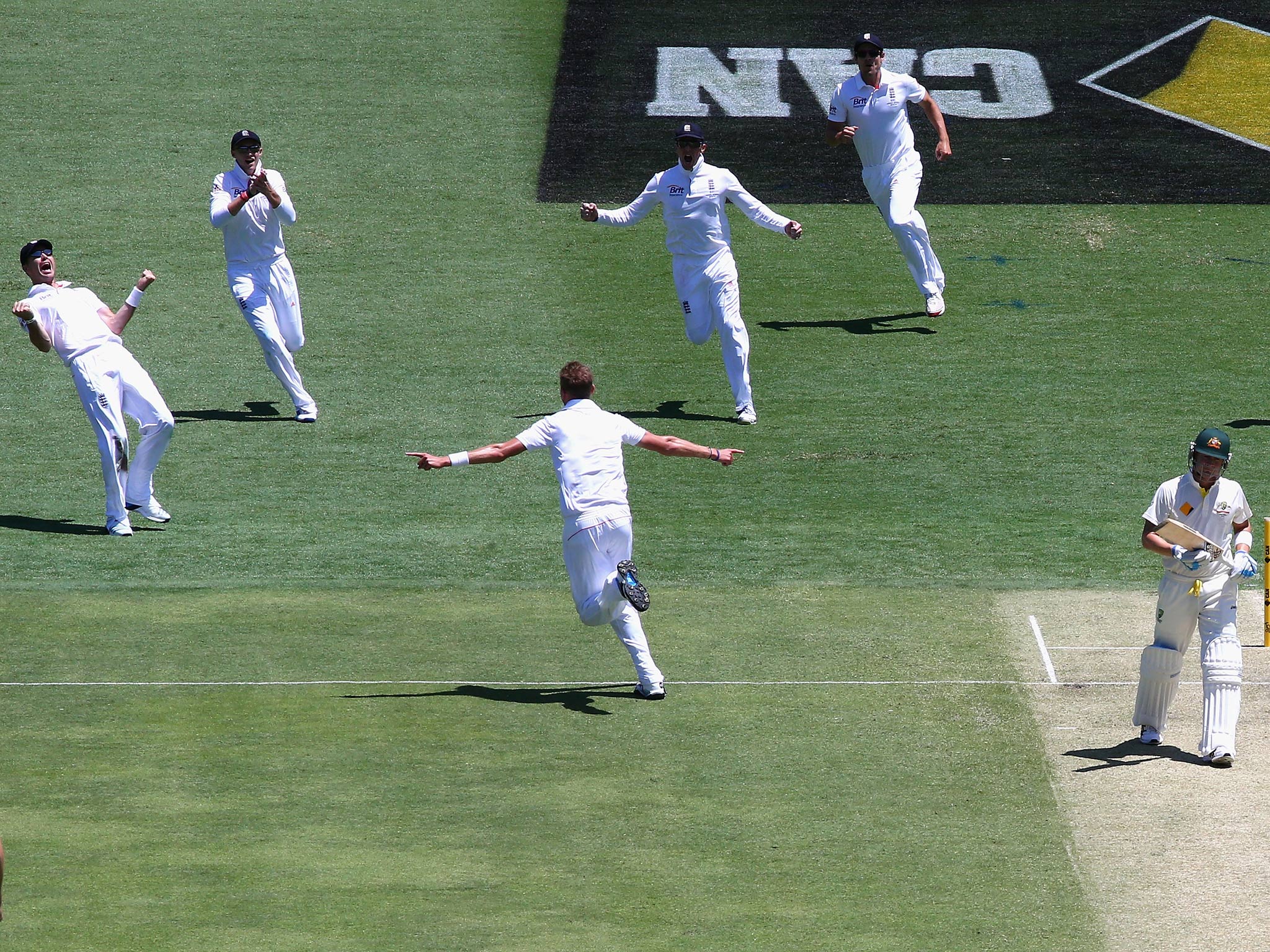 James Anderson (L) of England celebrates after Stuart Broad of England claimed the wicket of Michael Clarke of Australia during day one of the First Ashes Test match between Australia and England at The Gabba