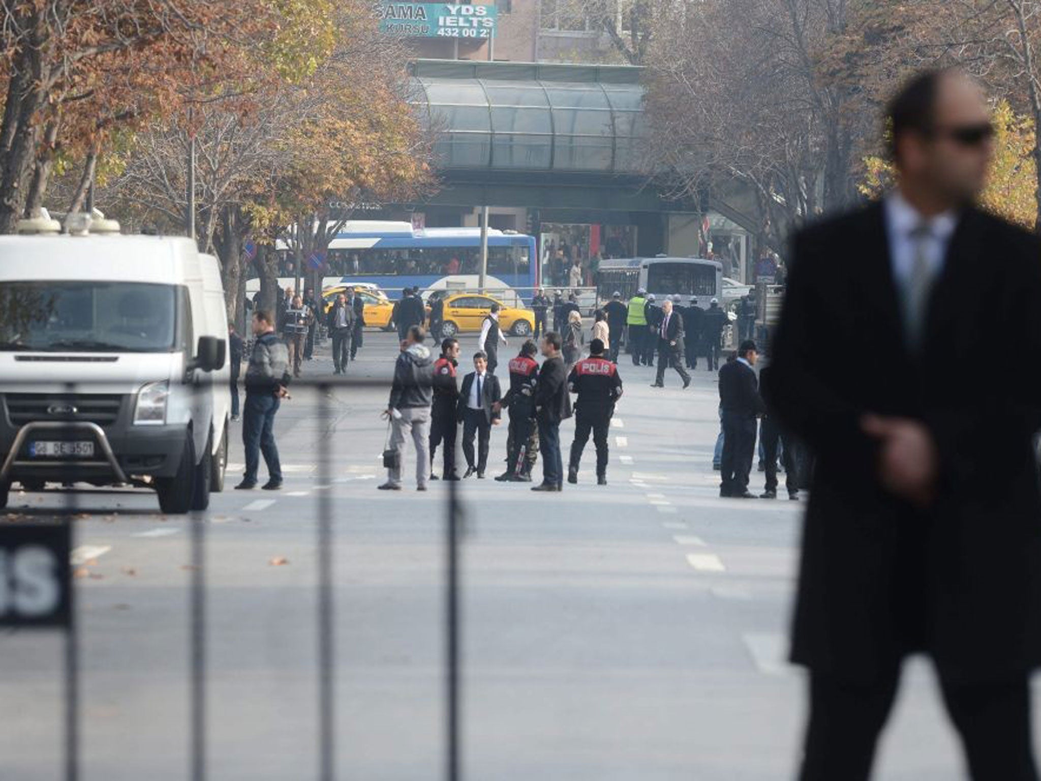 Turkish police secure the area after they shot and wounded a suspected suicide bomber close to the prime minister's office in Ankara, Turkey 21 November 2013
