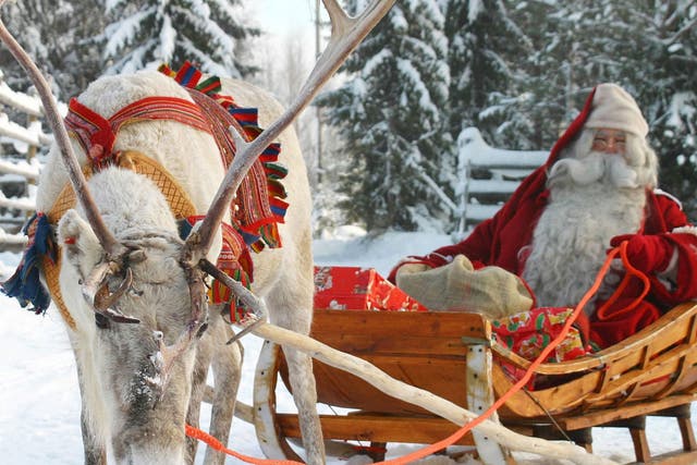 On the hoof: Santa and his reindeer in Rovaniemi, Finland