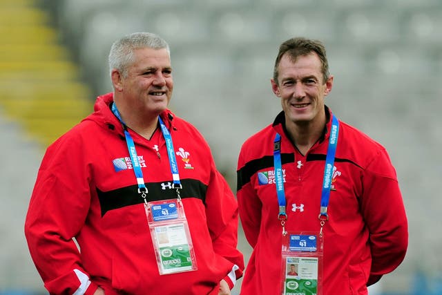 Wales coach Warren Gatland (left) and his assistant Rob Howley talk tactics