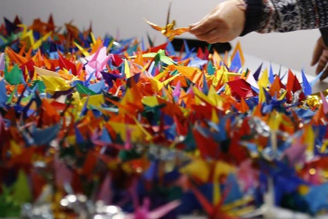 <p>Paper cranes are supposed to be ephemeral, left to disintegrate and then to release their wishes for peaces </p>