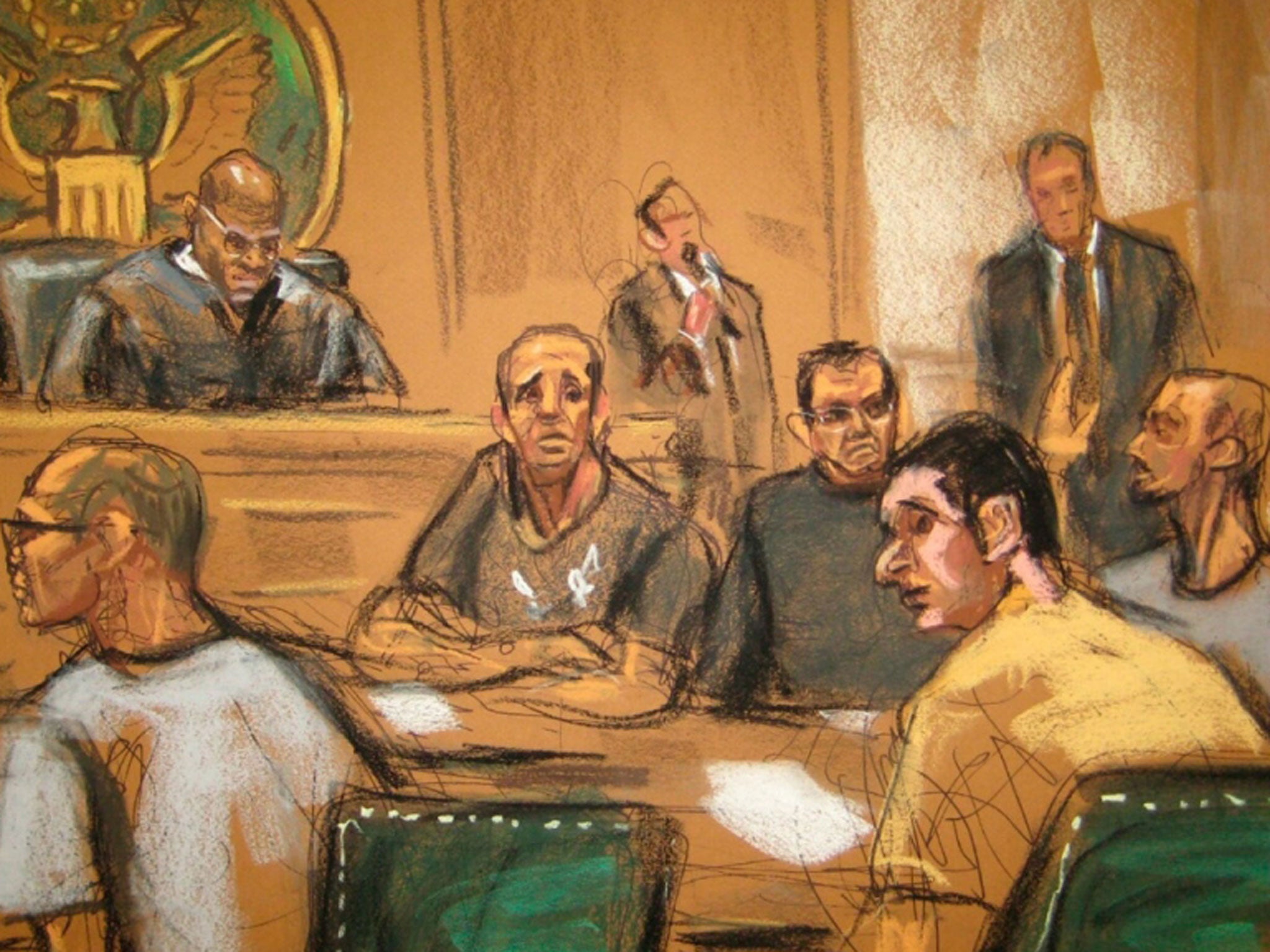 An artists impression of the five men sat in court after being extradited to the US. 