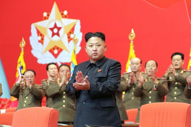 North Korean leader Kim Jong Un applauds during the second meeting of security personnel of the Korean People's Army
