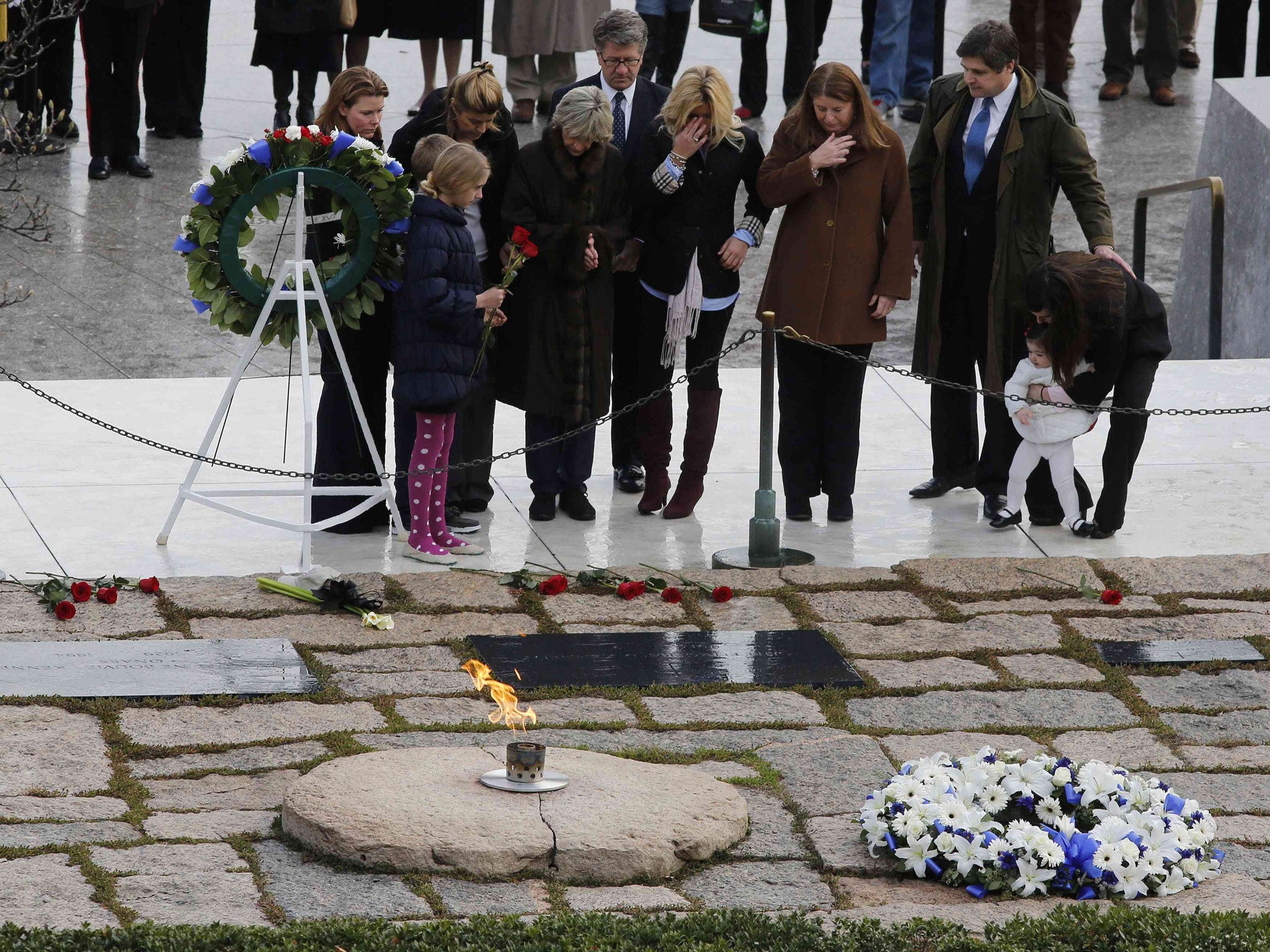 Members of the Kennedy family pay their respects at Arlington National Cemetery to mark the 50th anniversary of the assassination of former U.S. President John F. Kennedy