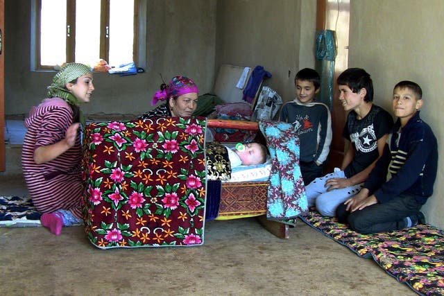 A migrant worke's family at their home in the Tajik capital Dushanbe