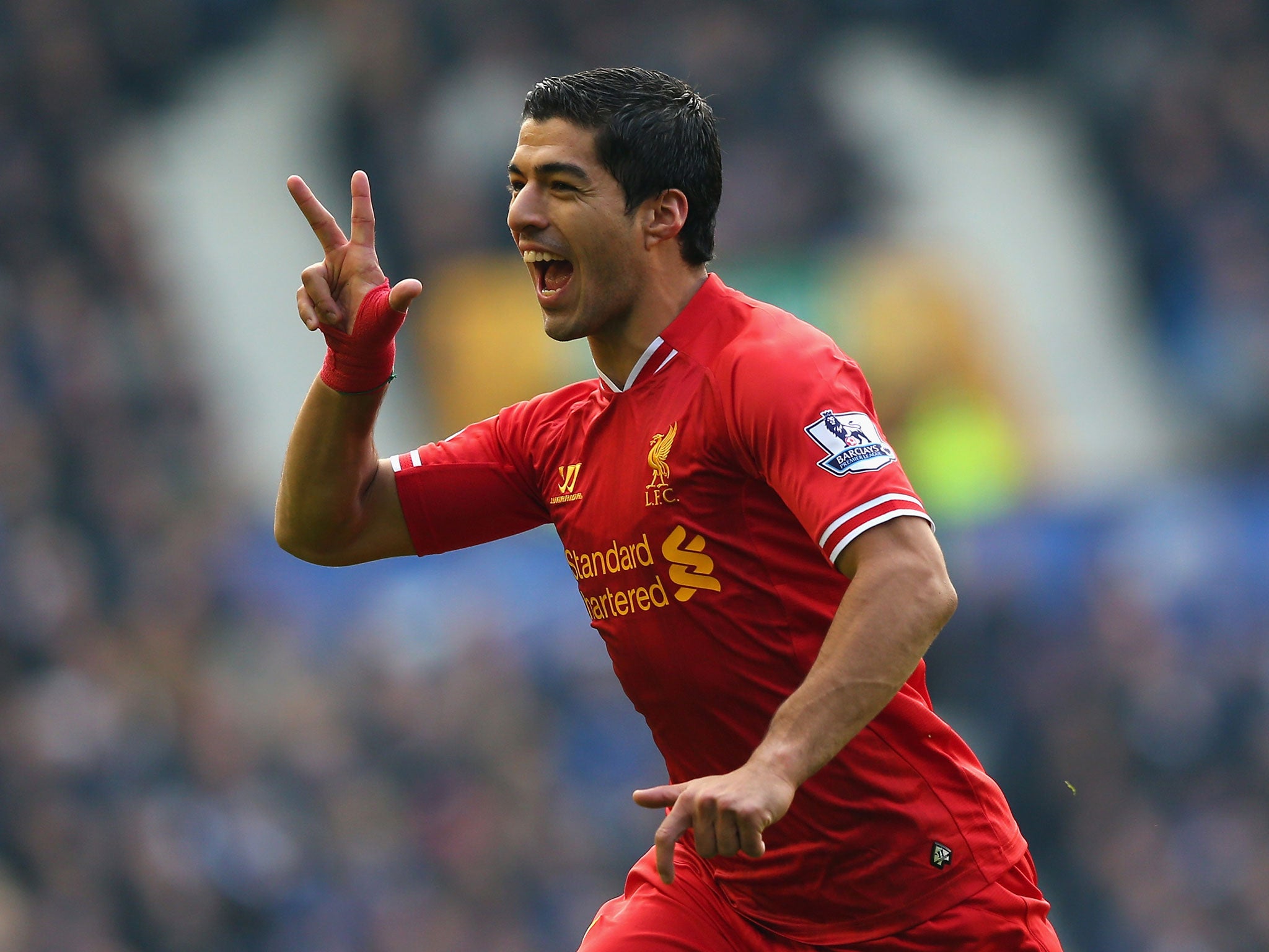 Luis Suarez of Liverpool celebrates scoring his team's second goal