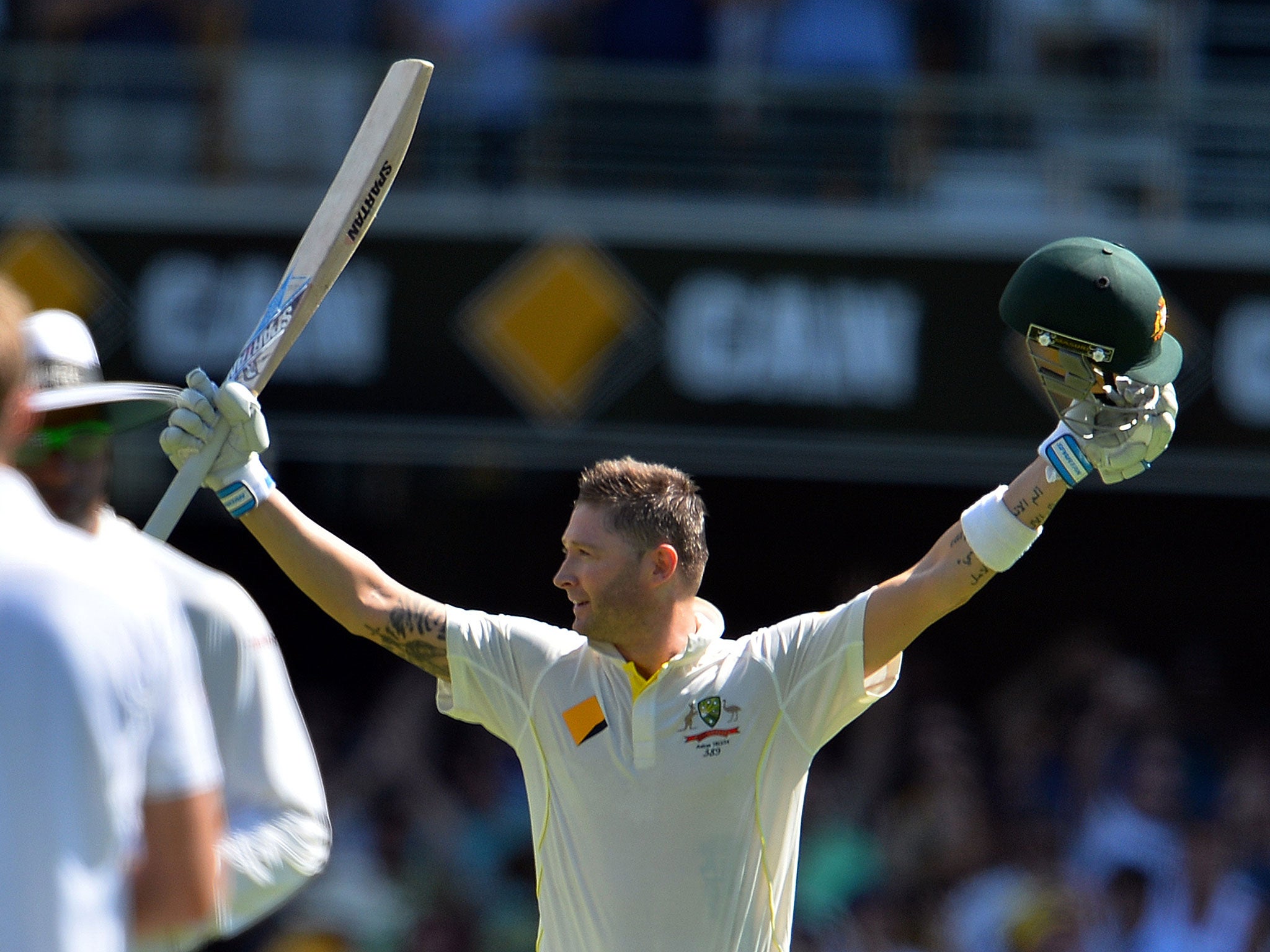 Australia's batsman Michael Clarke celebrates his 100 runs